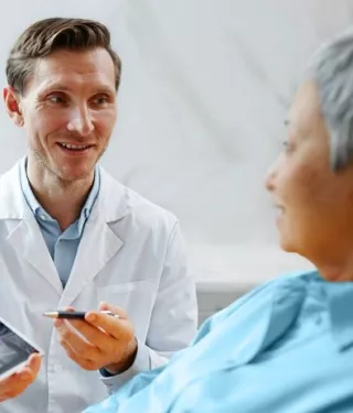 Nobel Biocare doctor speaking with a patient